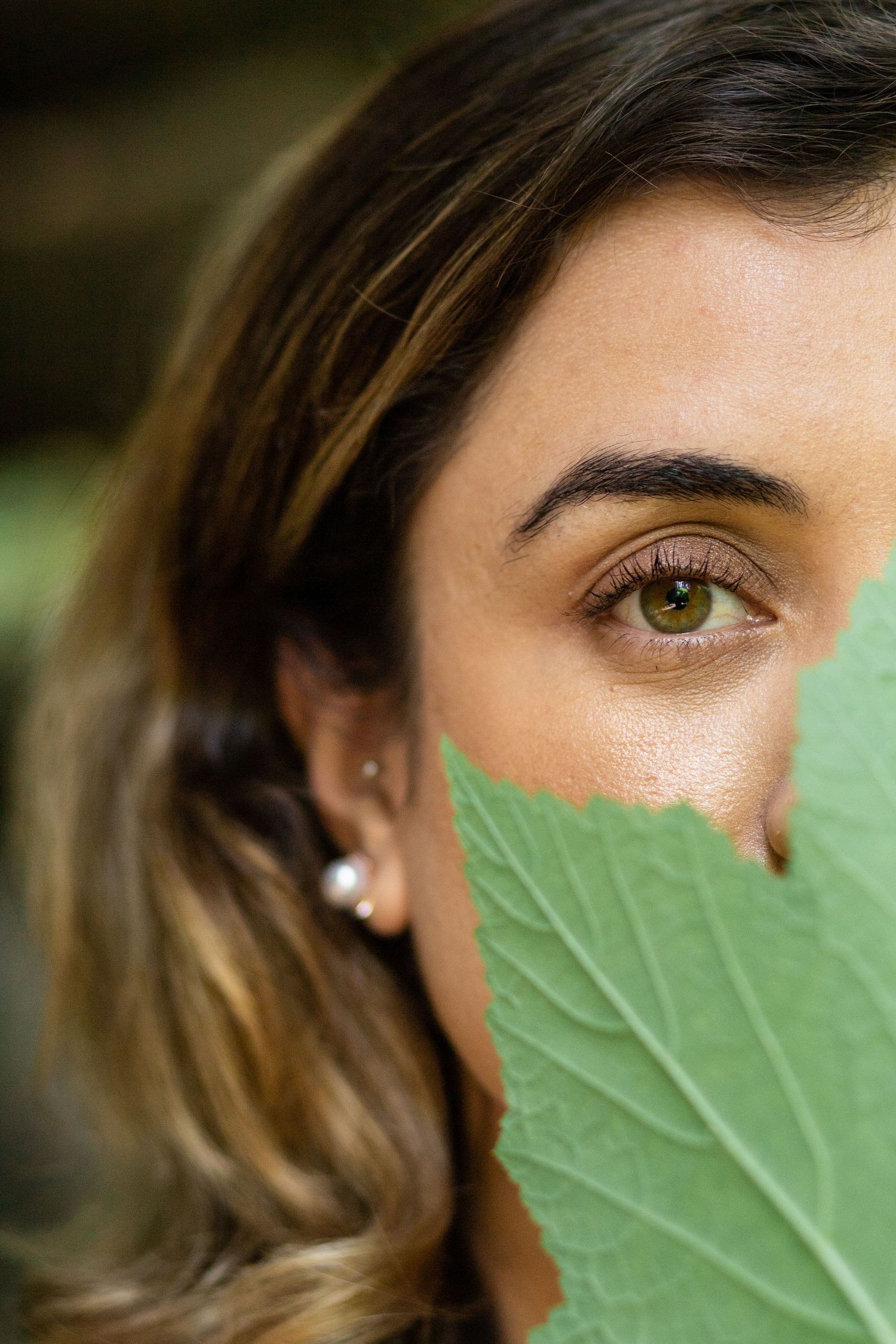 Close up of woman's hazel colored eye on Maui