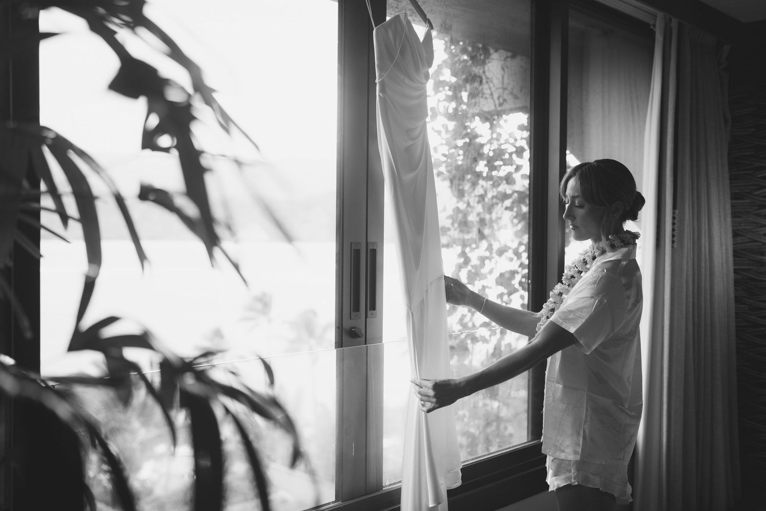 bride looking at dress at 1 Hotel Hanalei Bay