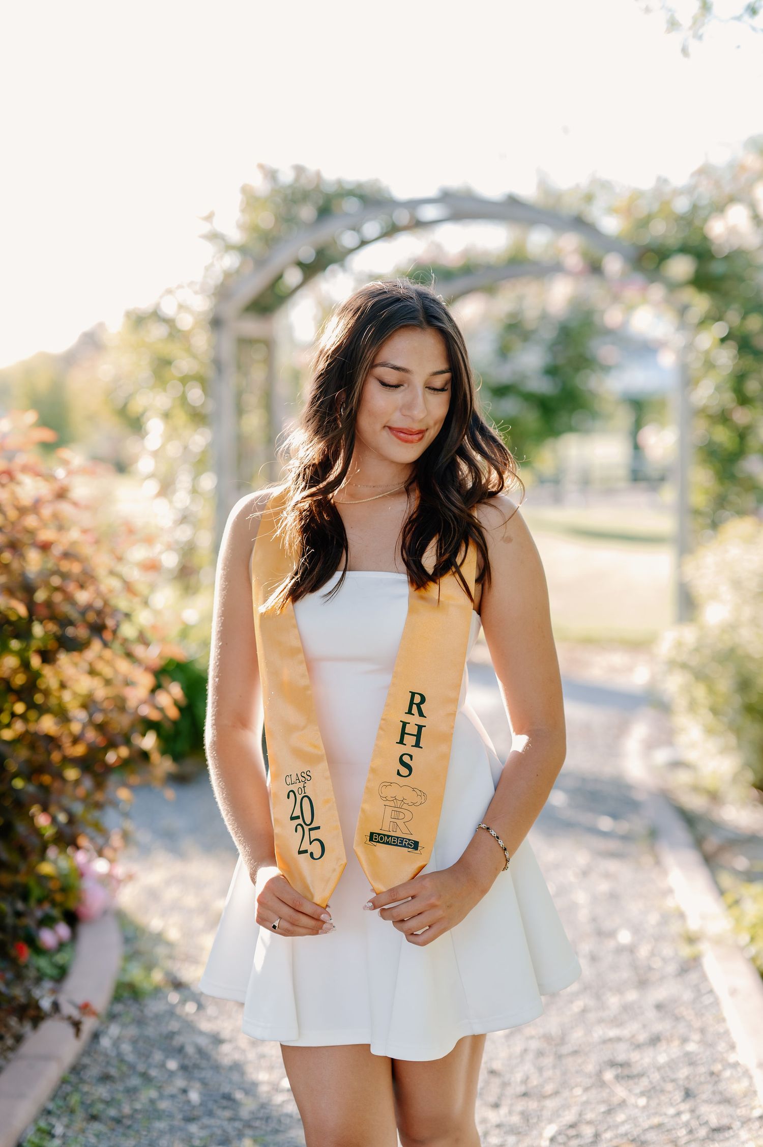 Garden senior pictures in the spring at golden hour