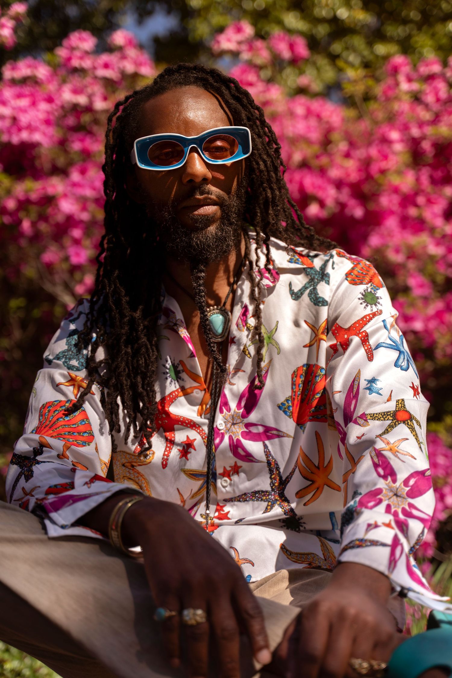 Photographer Tim Ellis wearing a starfish print shirt while documenting the Azalea Festival Garden Party in Wilmington, North Carolina
