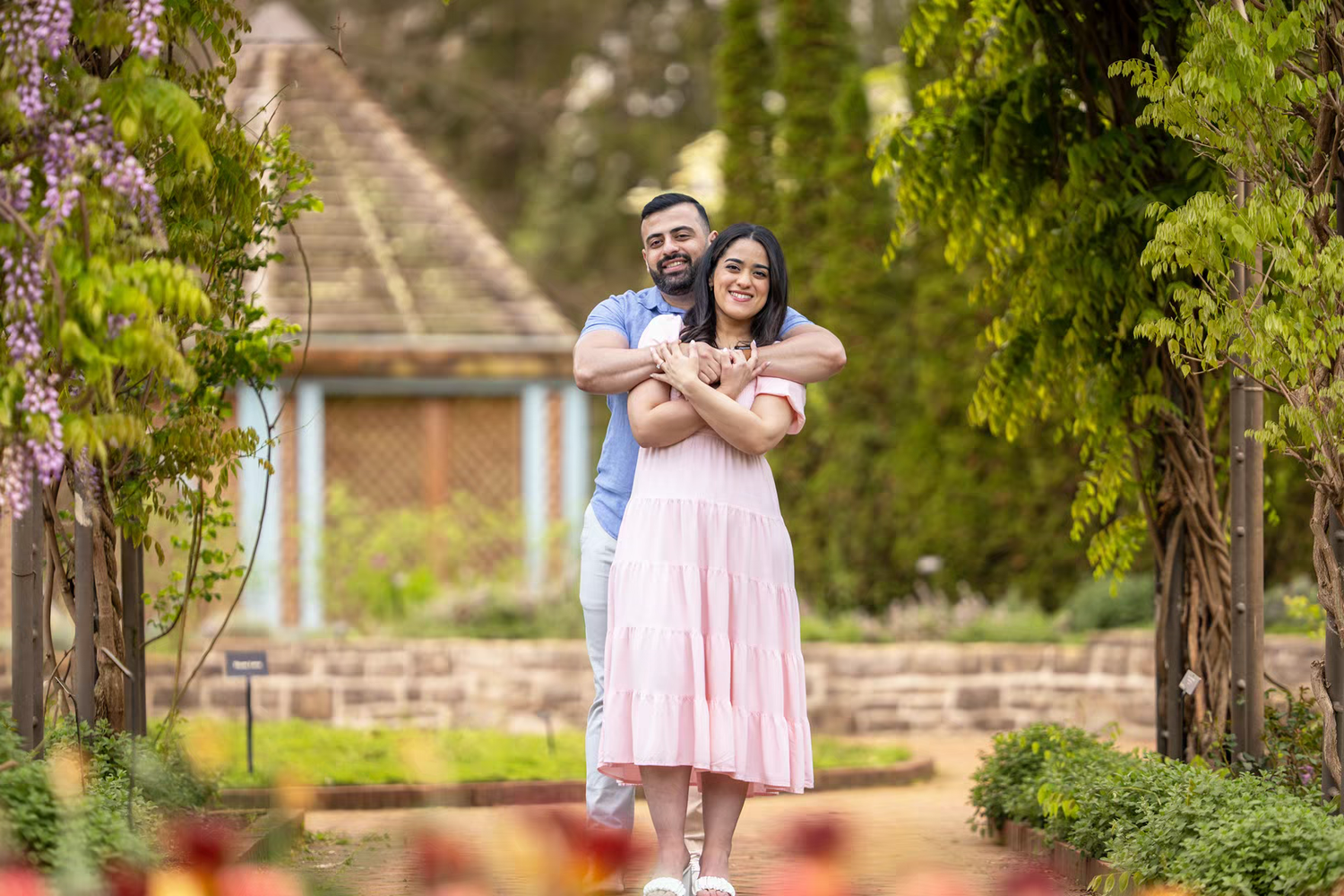 romantic couple embraces in Inniswood Metro Gardens going Engagement Photos