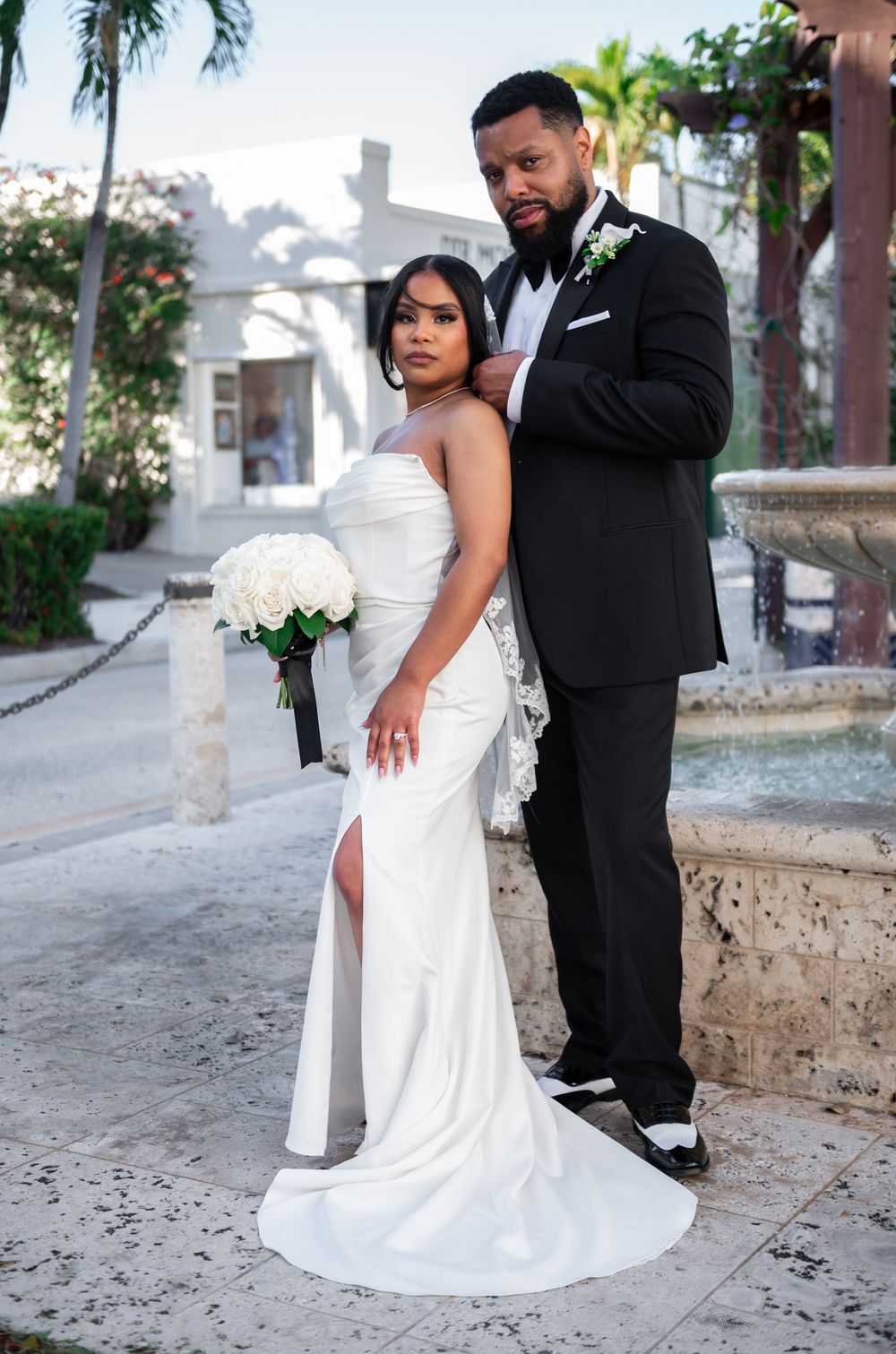 Bride and groom embracing in West Palm Beach after wedding ceremony