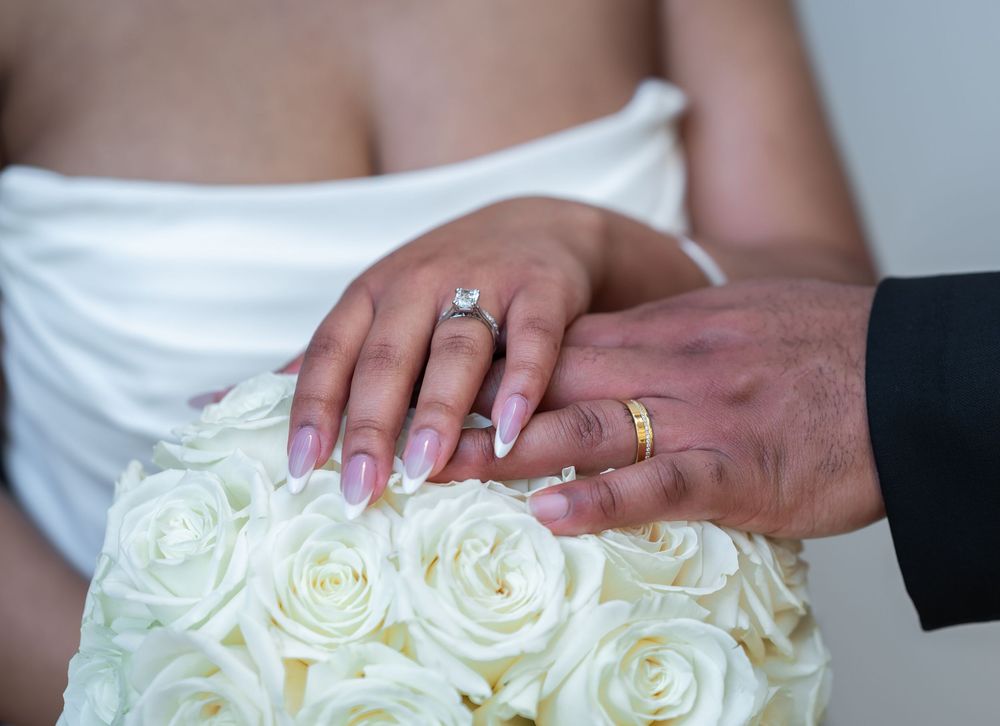 Close-up of bride and groom wedding bands captured by luxury wedding photographers in Florida