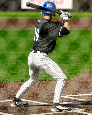 Baseball batter number 16 in black pinstripe uniform swings at pitch during game.