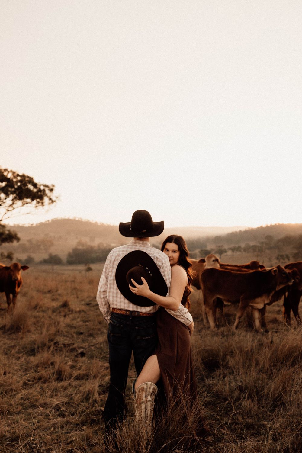 A sepia-toned photo series shows a couple embracing in a rustic field with horses grazing in the background.