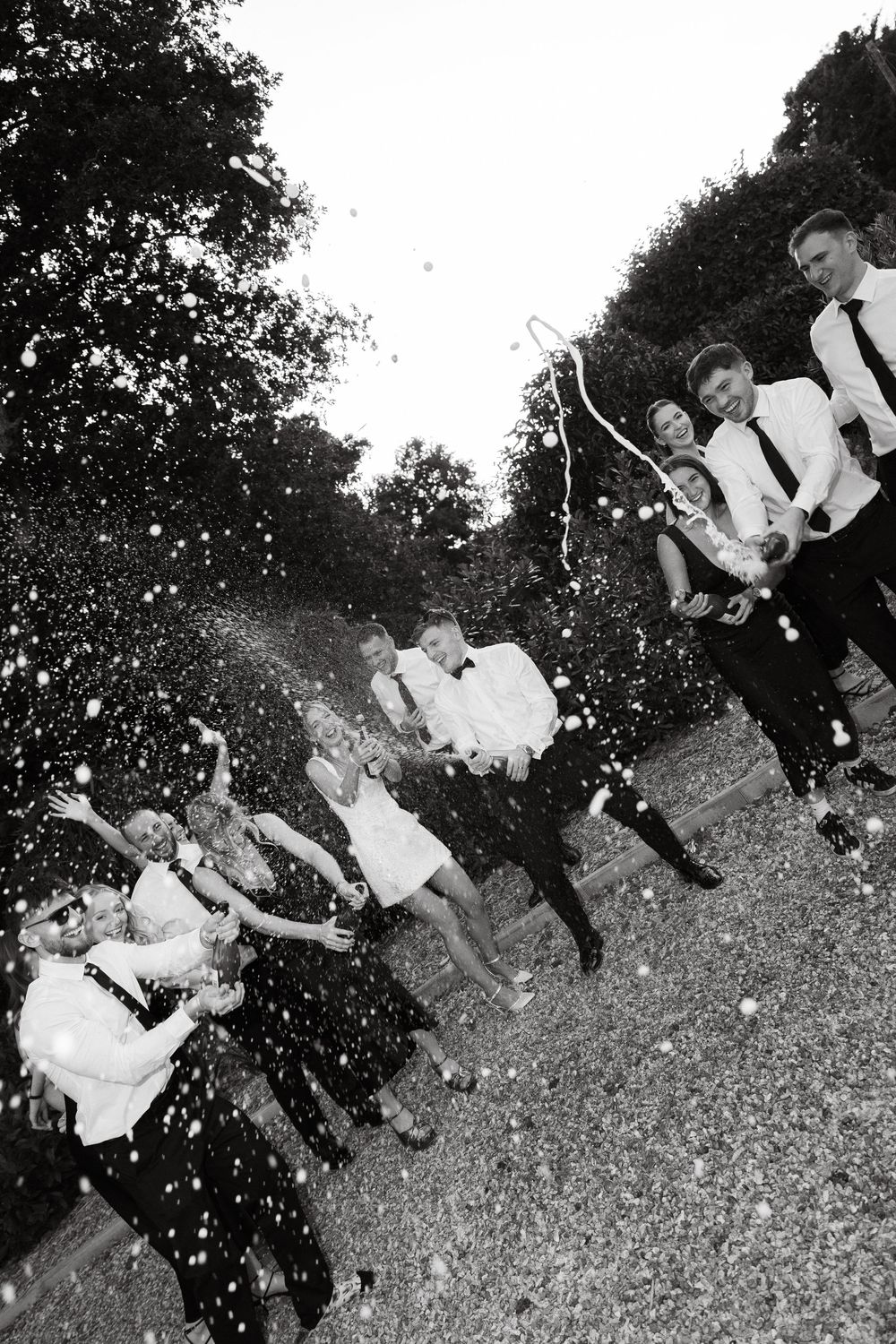 Black and white photos of people celebrating outdoors with dramatic lighting effects.