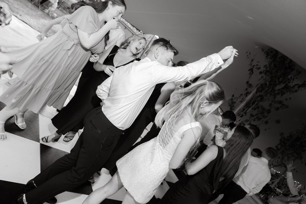 A sequence of black and white shots capturing lively party moments.
