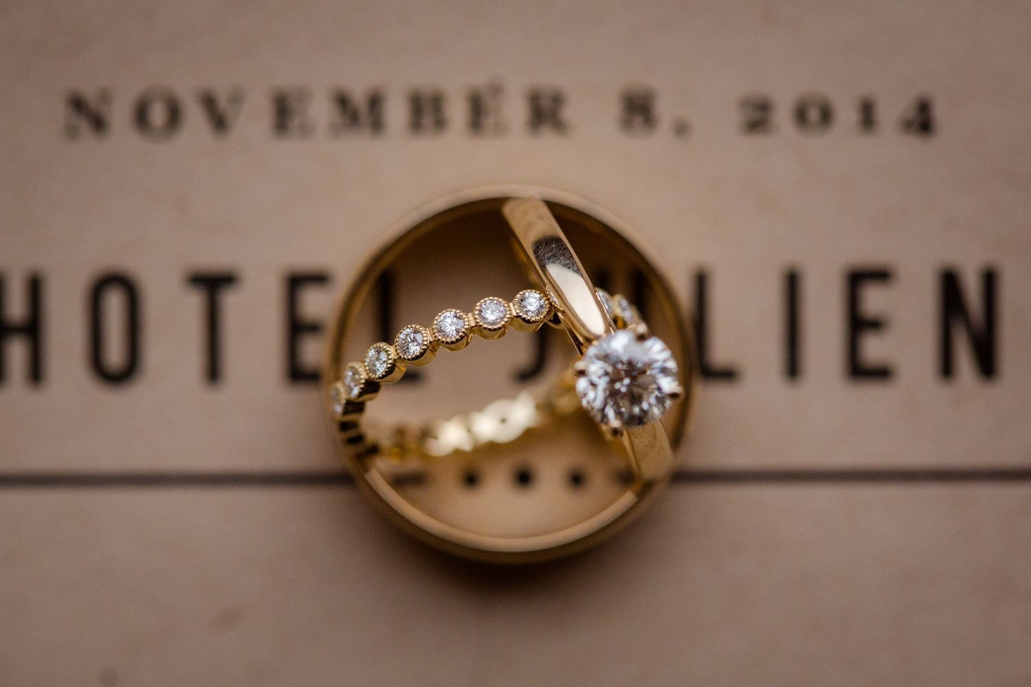 Vintage wedding at the Hotel Julien in Dubuque, Iowa. Wedding rings and program.