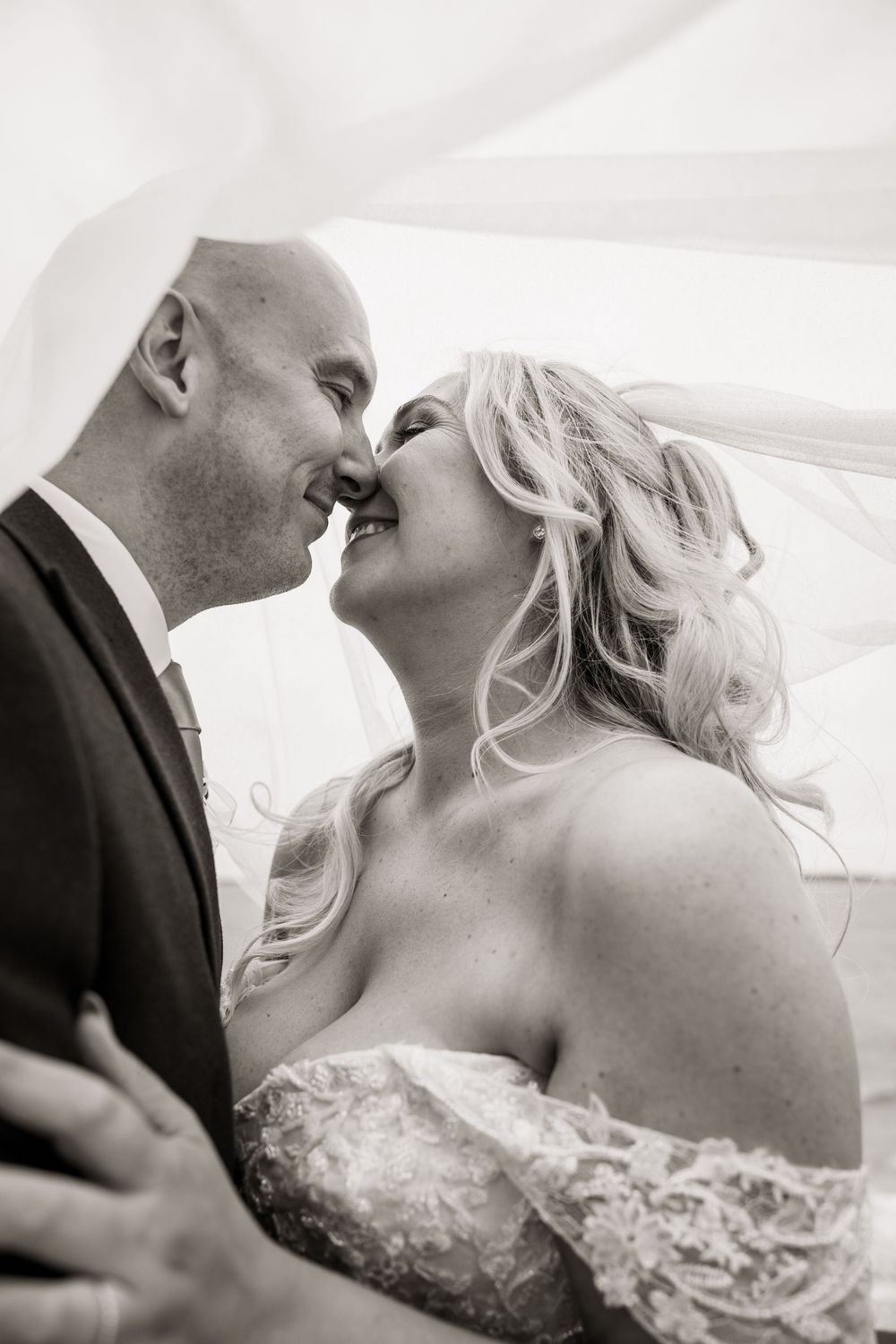 Black and white close-up wedding photography capturing intimate moments.
