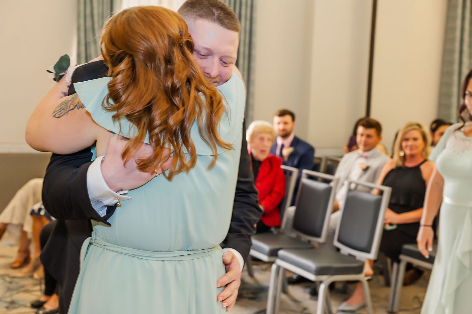 A series of candid wedding reception moments showing dancing and celebration in an indoor venue.