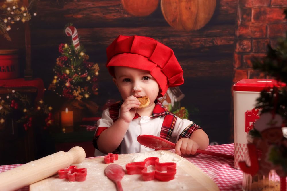A festive holiday scene with red decor, candy canes, and Christmas tree in a rustic setting with pumpkins.