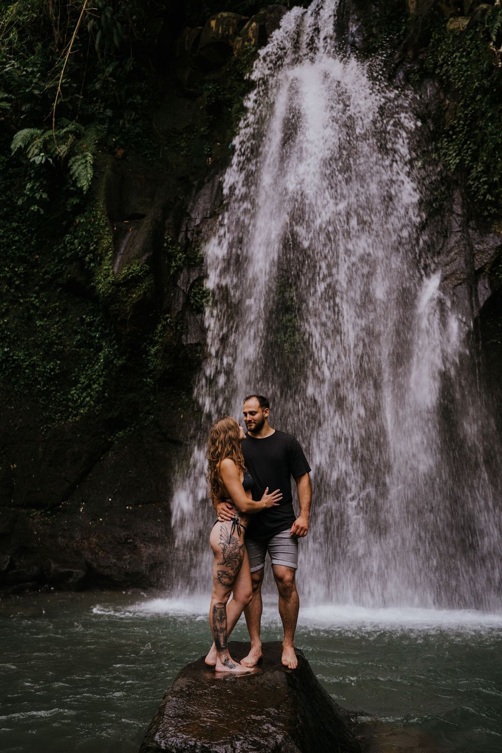 Bali couple photography services at Ulu Petanu Waterfall in Ubud.