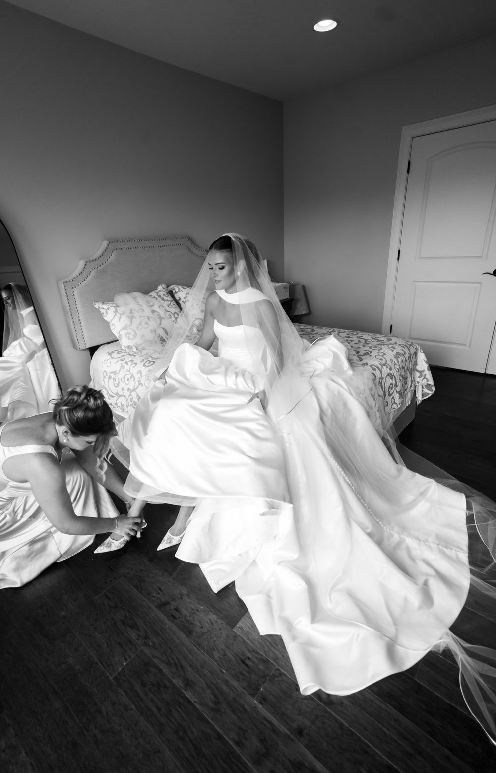 Black and white artistic photo series showing flowing white fabric against dark background.