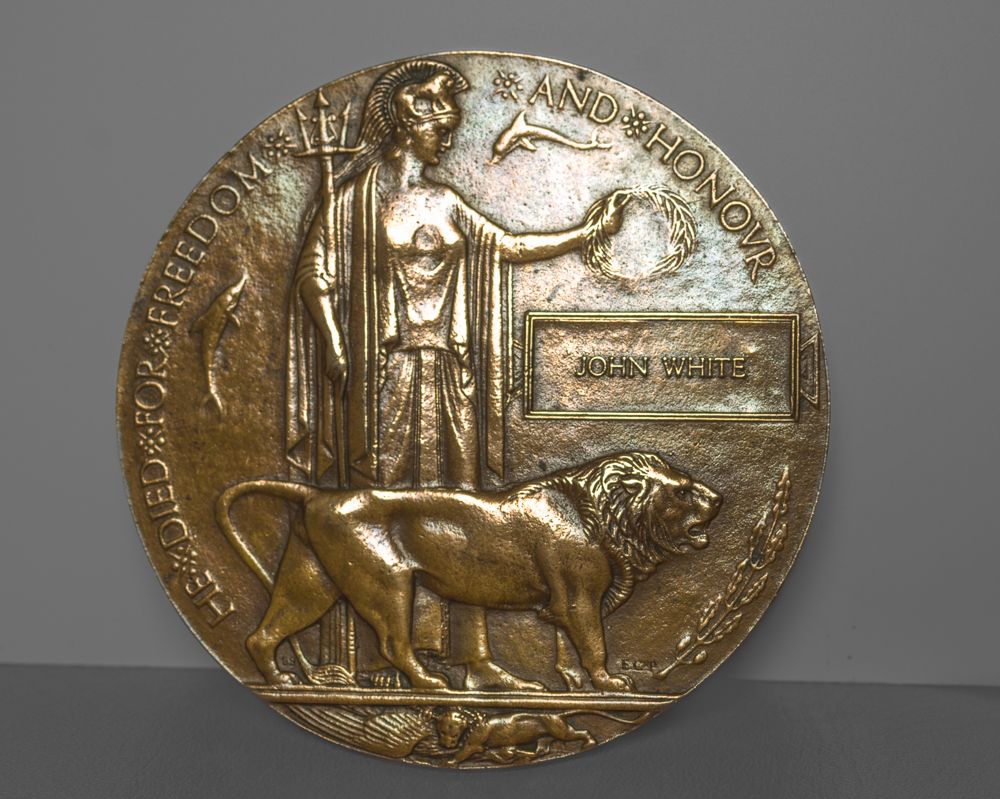 Ancient Greek gold coin showing a figure standing beside a bull in profile against a textured metallic background.