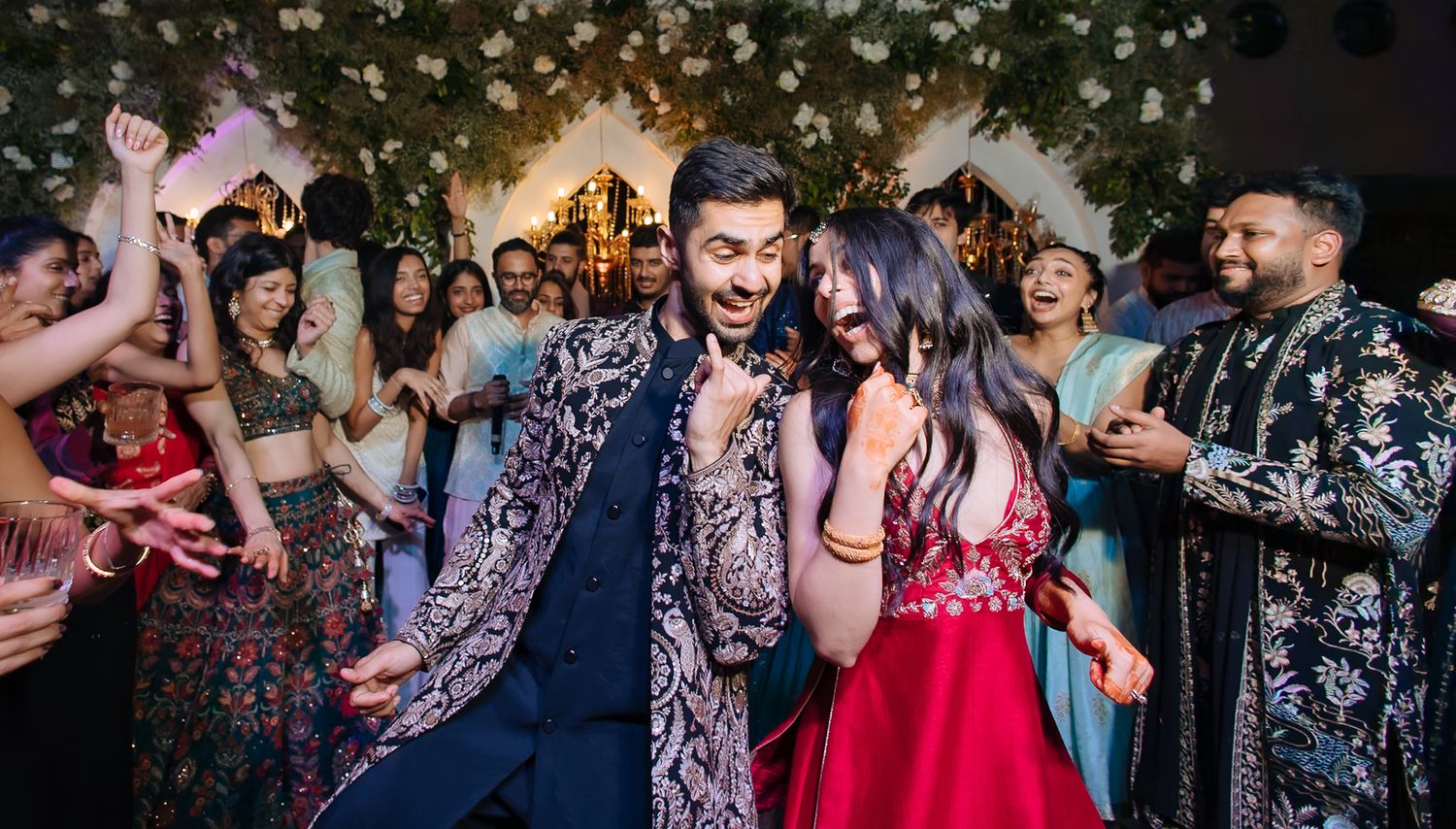 Bride and groom leading an unforgettable dance battle at their wedding celebration at Tivoli Chattarpur