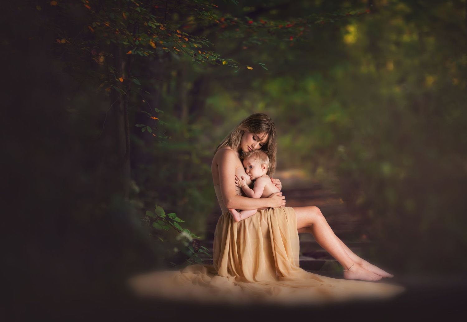 A soft, ethereal forest scene with golden sunlight filtering through the trees.