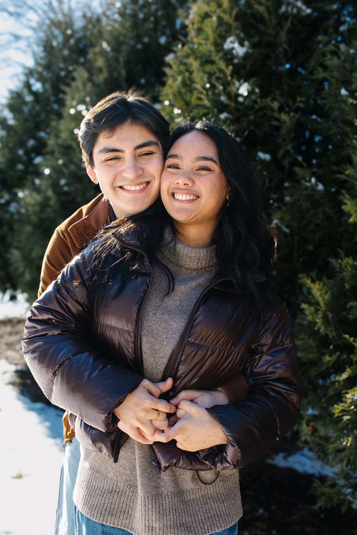 A romantic engagement photo session in a golden marsh field during sunset.