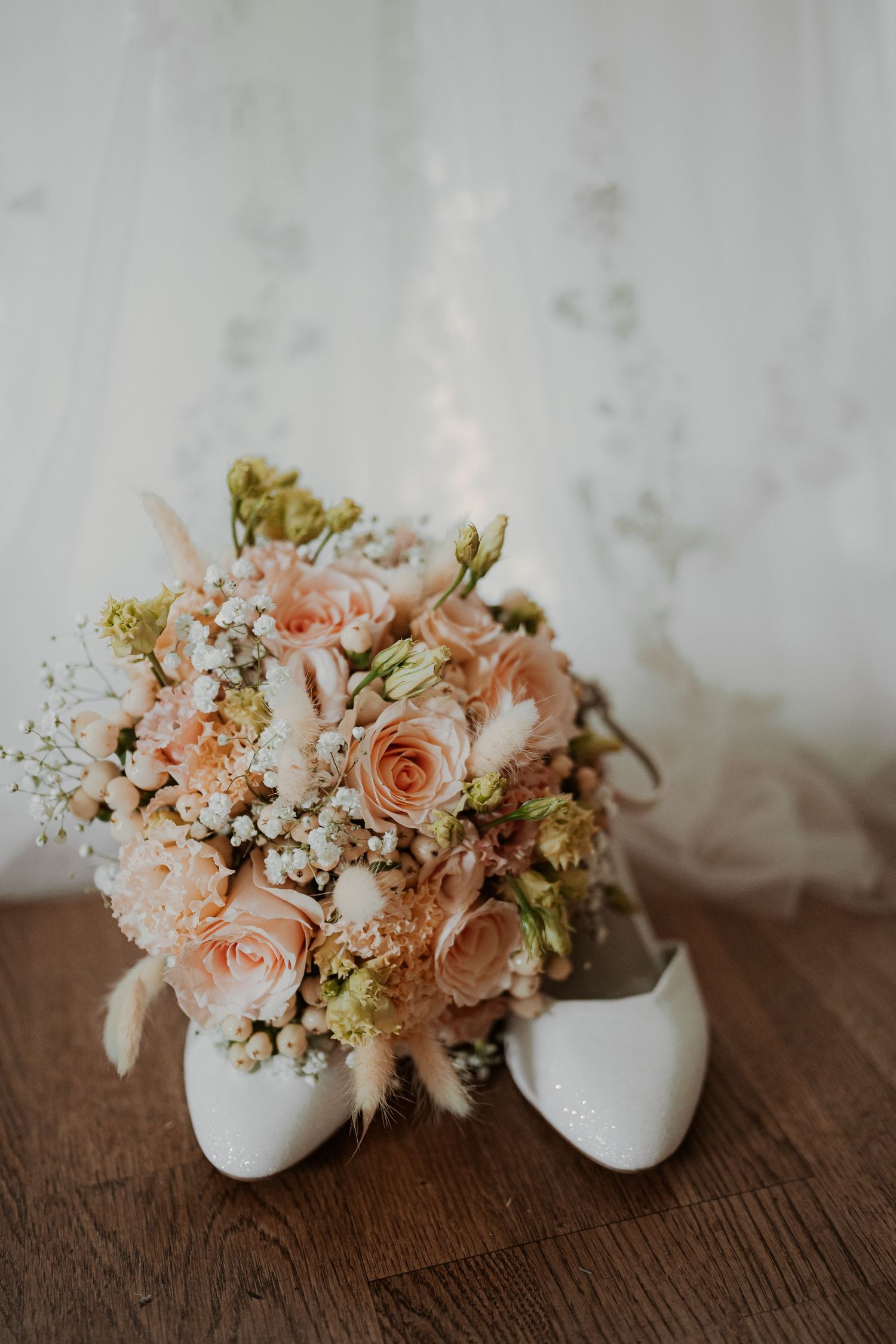 Intimate romantic couple sharing tender kisses in moody lighting with warm orange glow.