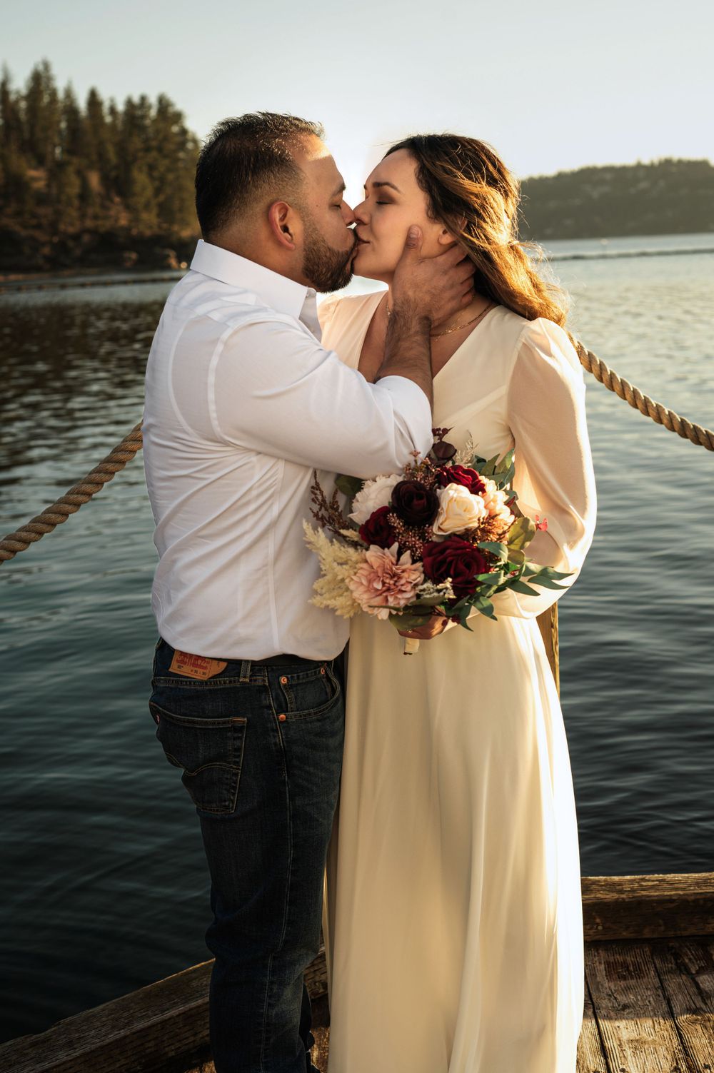 Bride and groom on Lake CDA in Idaho. Taken by Jessica Rae Photography.