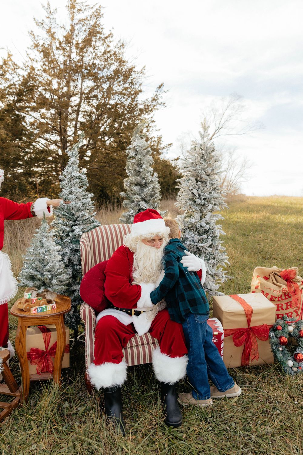 A series of holiday photos showing Santa Claus and children in matching outfits sitting on wooden benches in a snowy outdoor setting.