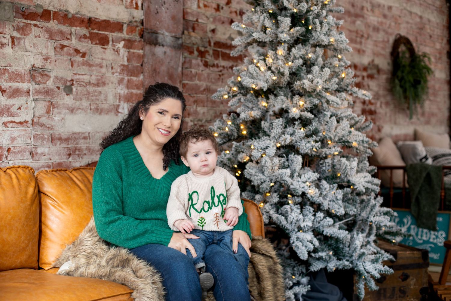 Mom holding her 11 month old son during a cozy Christmas family photography session in Cincinnati, capturing connection and quiet holiday mo