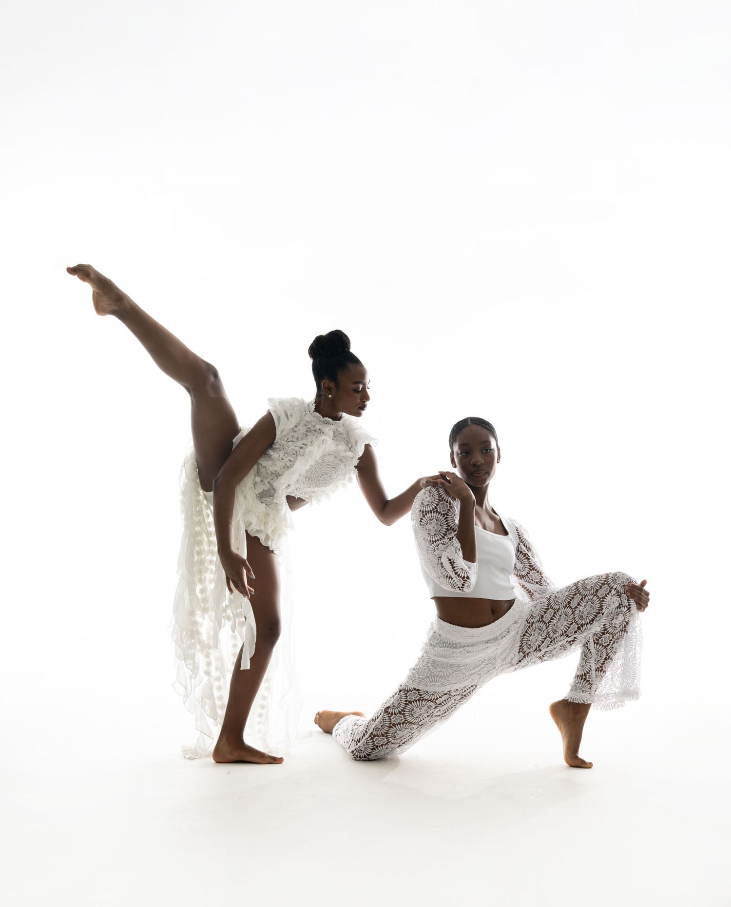 A sequence of dynamic dance poses showing a performer in white clothing against a white background.