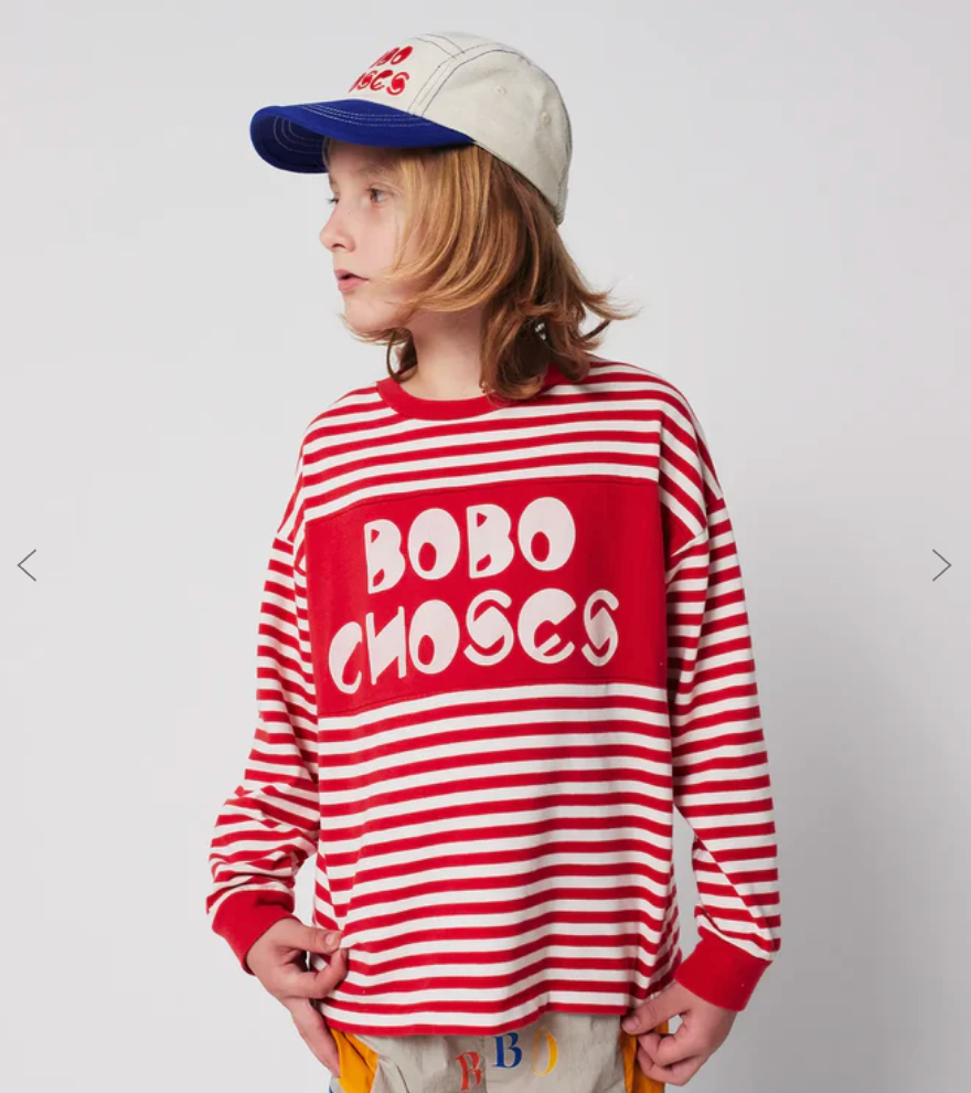 A red and white striped sweater with bubble text design displayed from multiple angles.