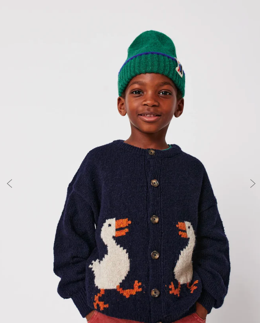 Navy blue knit cardigan sweater with white duck designs and orange feet details for children's winter wear.