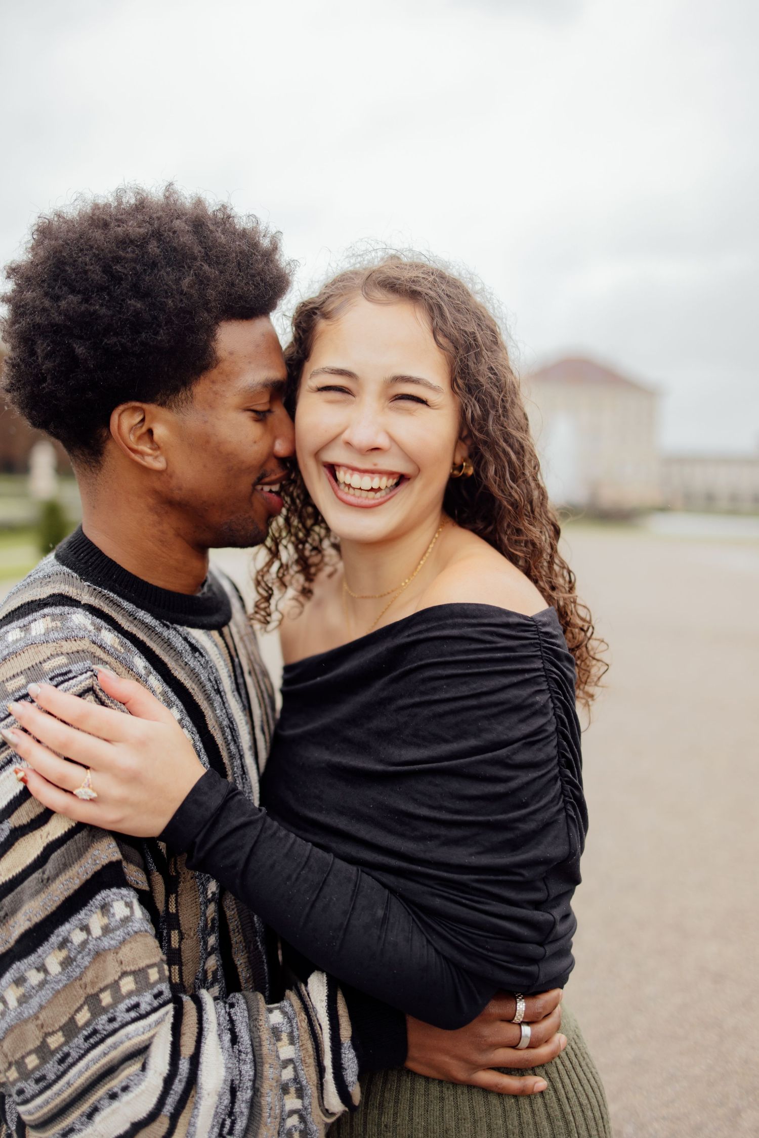 Newly engaged couple smiling at Nymphenburg palace, Munich Elopement Photographer, Munich Proposal Photographer, Engagement Photography
