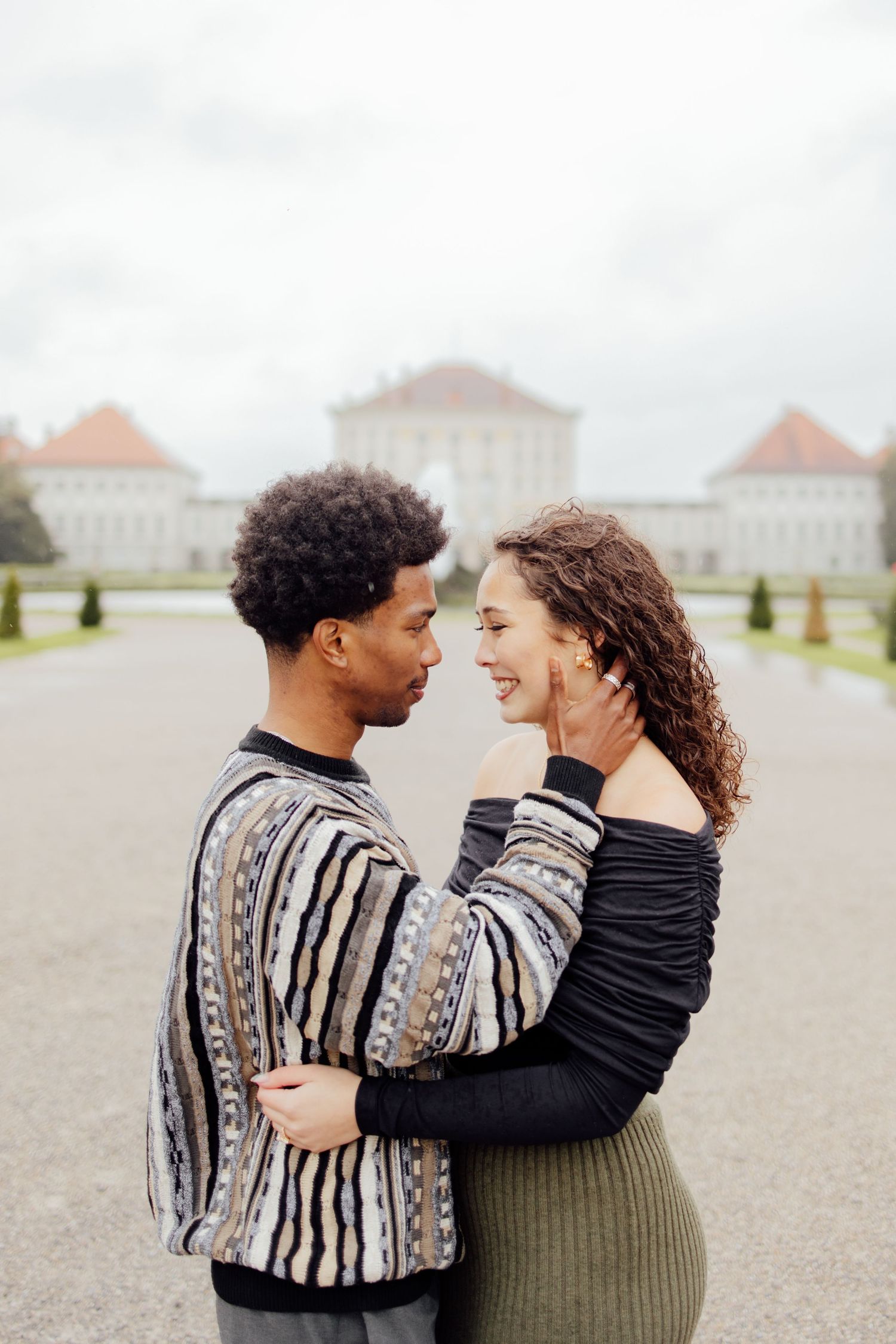 Newly engaged couple smiling at Nymphenburg palace, Munich Elopement Photographer, Munich Proposal Photographer, Engagement Photography