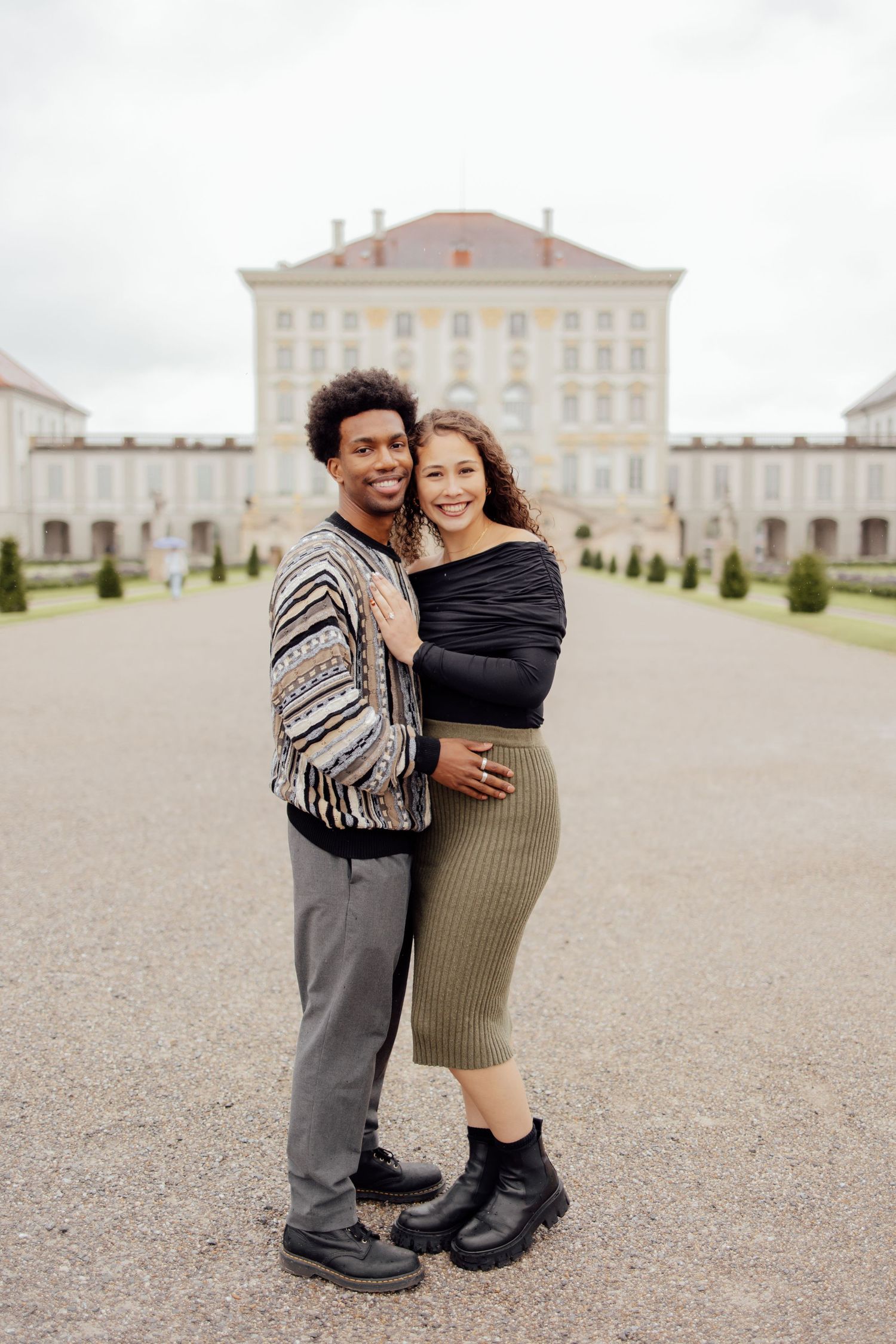 Newly engaged couple smiling into camera at Nymphenburg palace, Munich Elopement Photographer, Munich Proposal Photographer