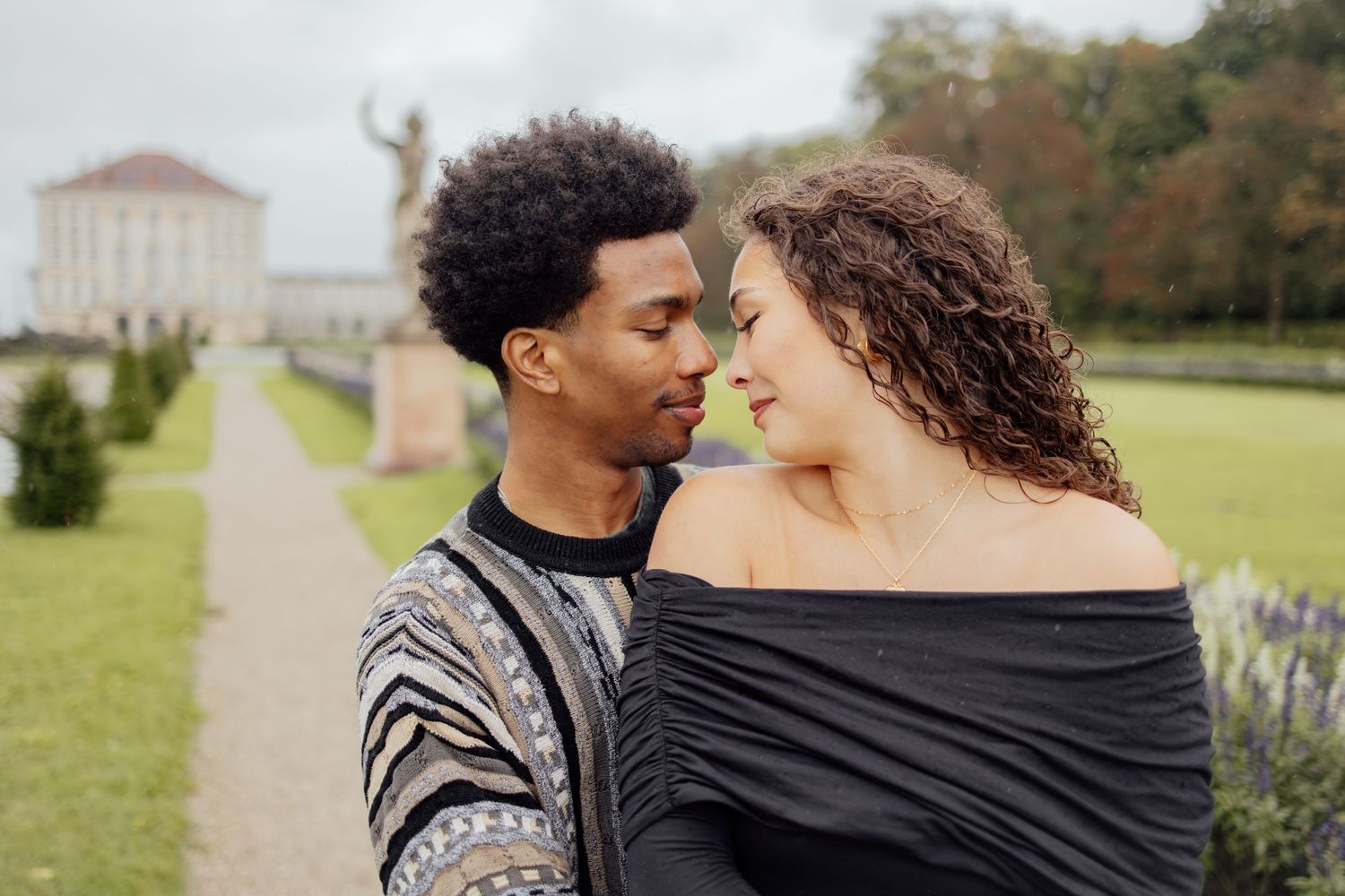 Newly engaged couple smiling at Nymphenburg palace, Munich Elopement Photographer, Munich Proposal Photographer, Engagement Photography