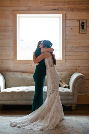 A series of emotional embraces in a rustic wooden room with a vintage couch.