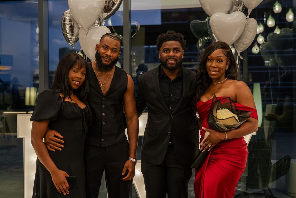 Celebration photos showing guests posing with decorative money arrangements and balloons at an evening event.