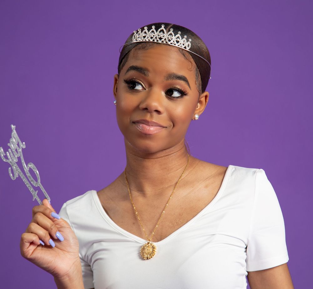 A series of five photos showing someone in a white t-shirt and silver crown making playful expressions against a purple background.