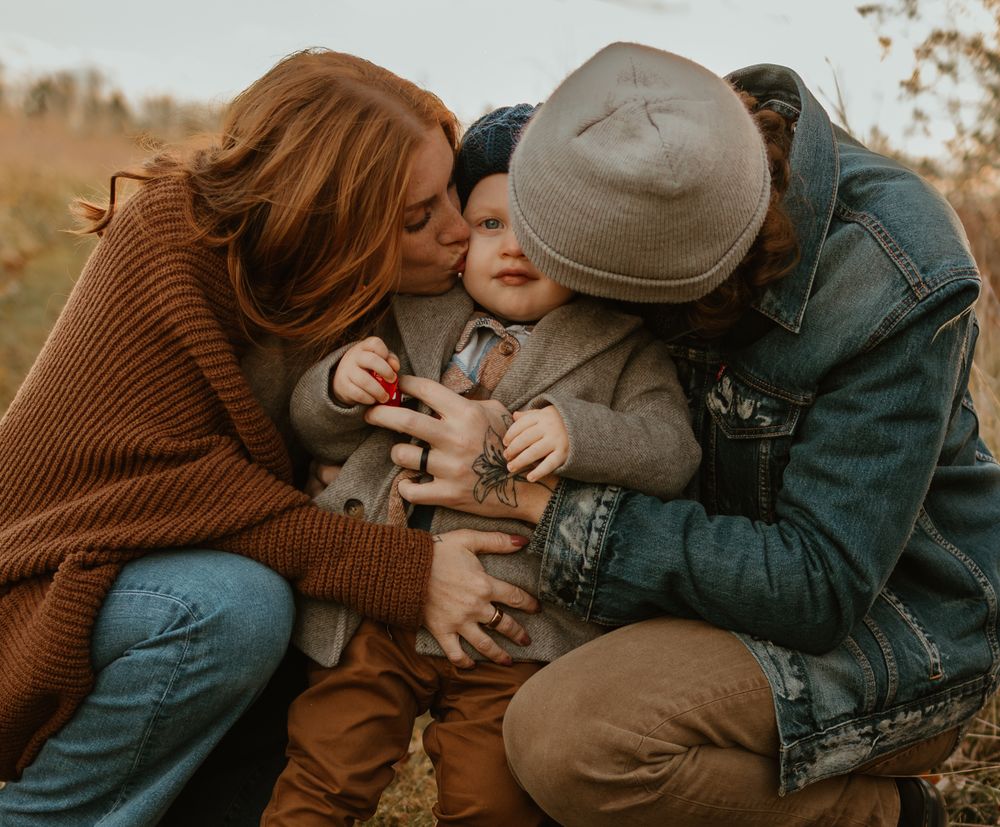Candid moments captured in autumn tones with cozy sweaters and casual styling outdoors.