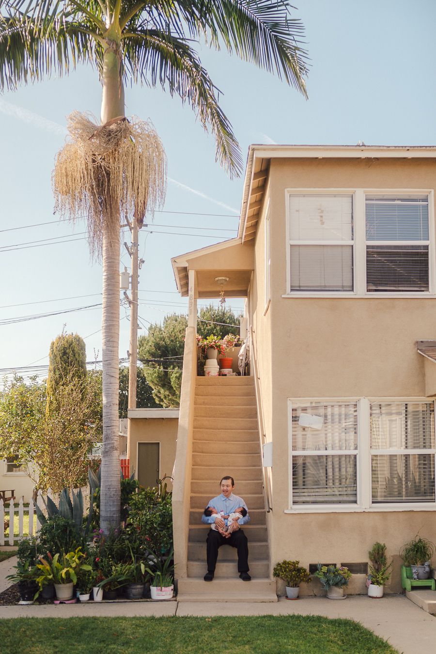 A series of four exterior photos showing a beige house with palm trees and potted plants in the yard.