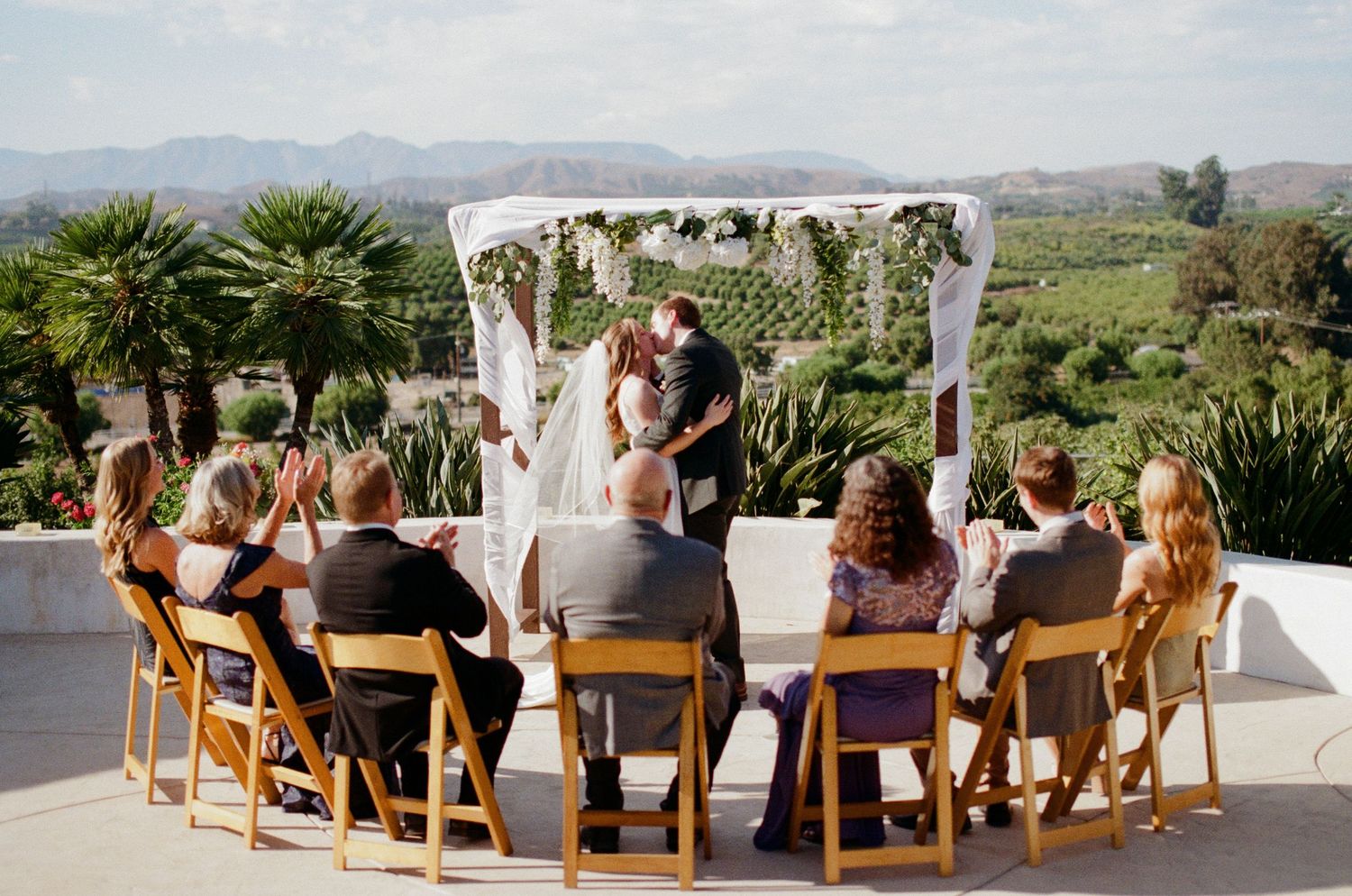 A Santa Barbara film photographer captures an intimate wedding ceremony in a vineyard setting.