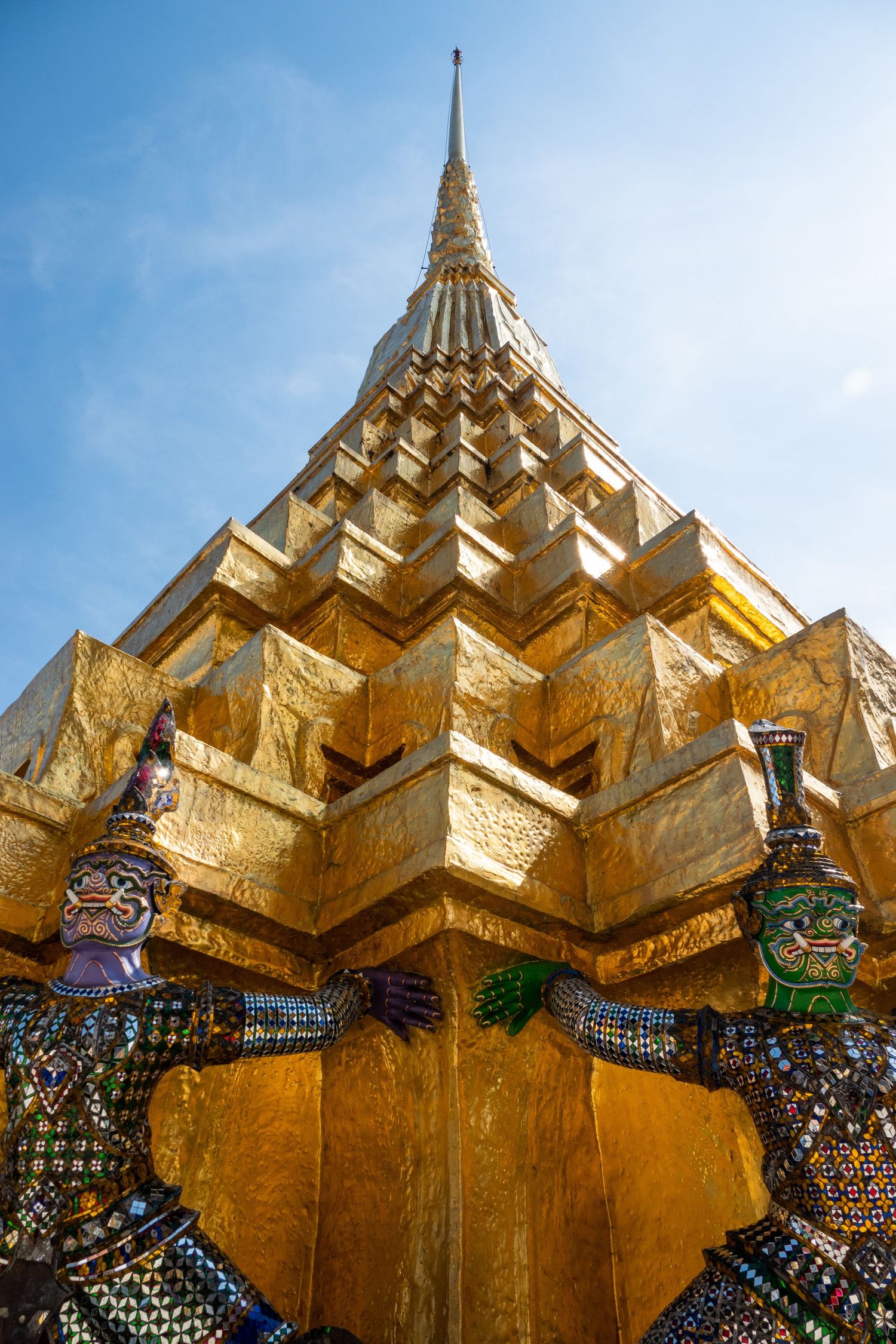 Golden spires and ornate decorative elements adorn the exterior of a traditional Thai Buddhist temple in Bangkok.