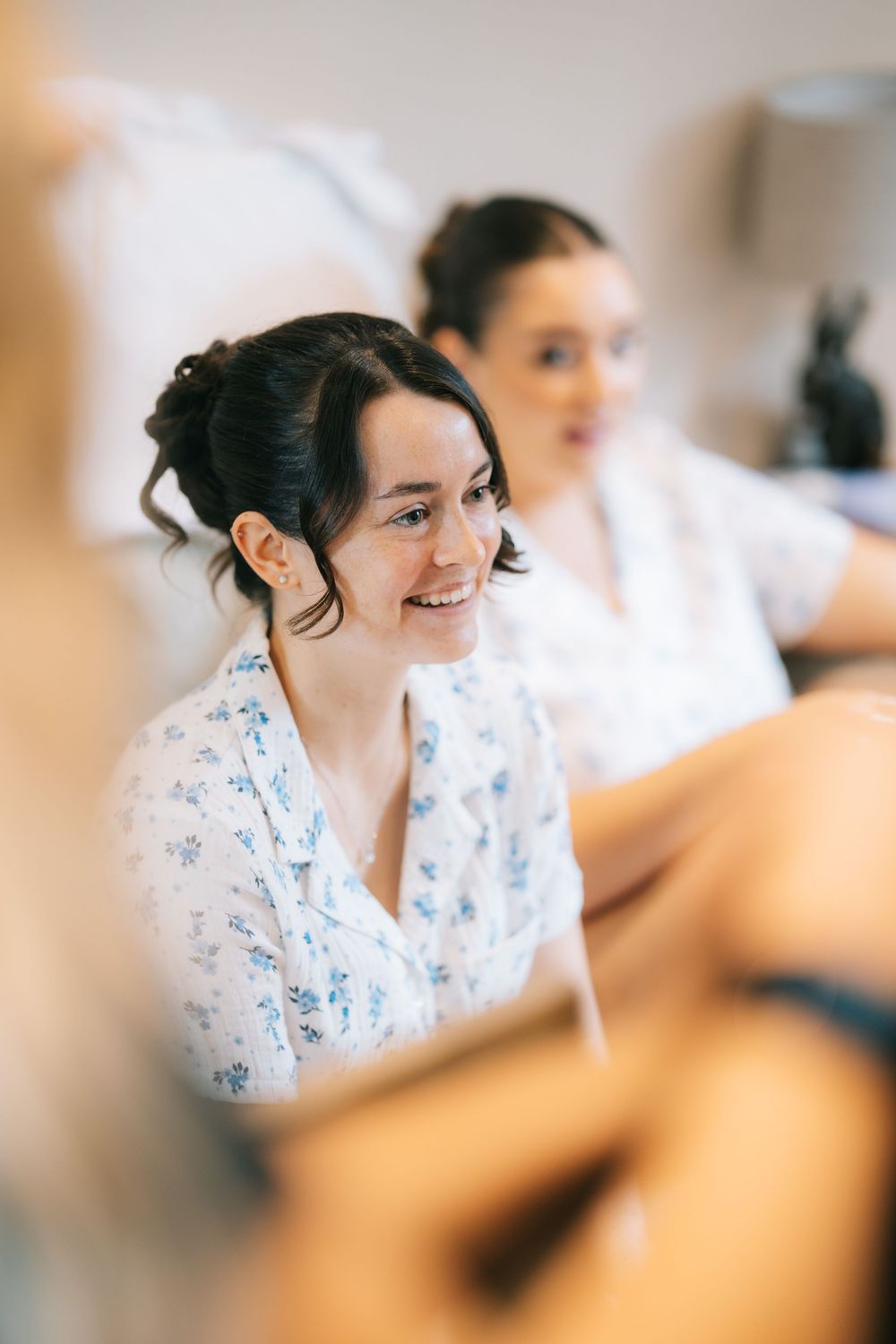 A bridesmaid smiles during prep at Pendrell Hall wedding venue