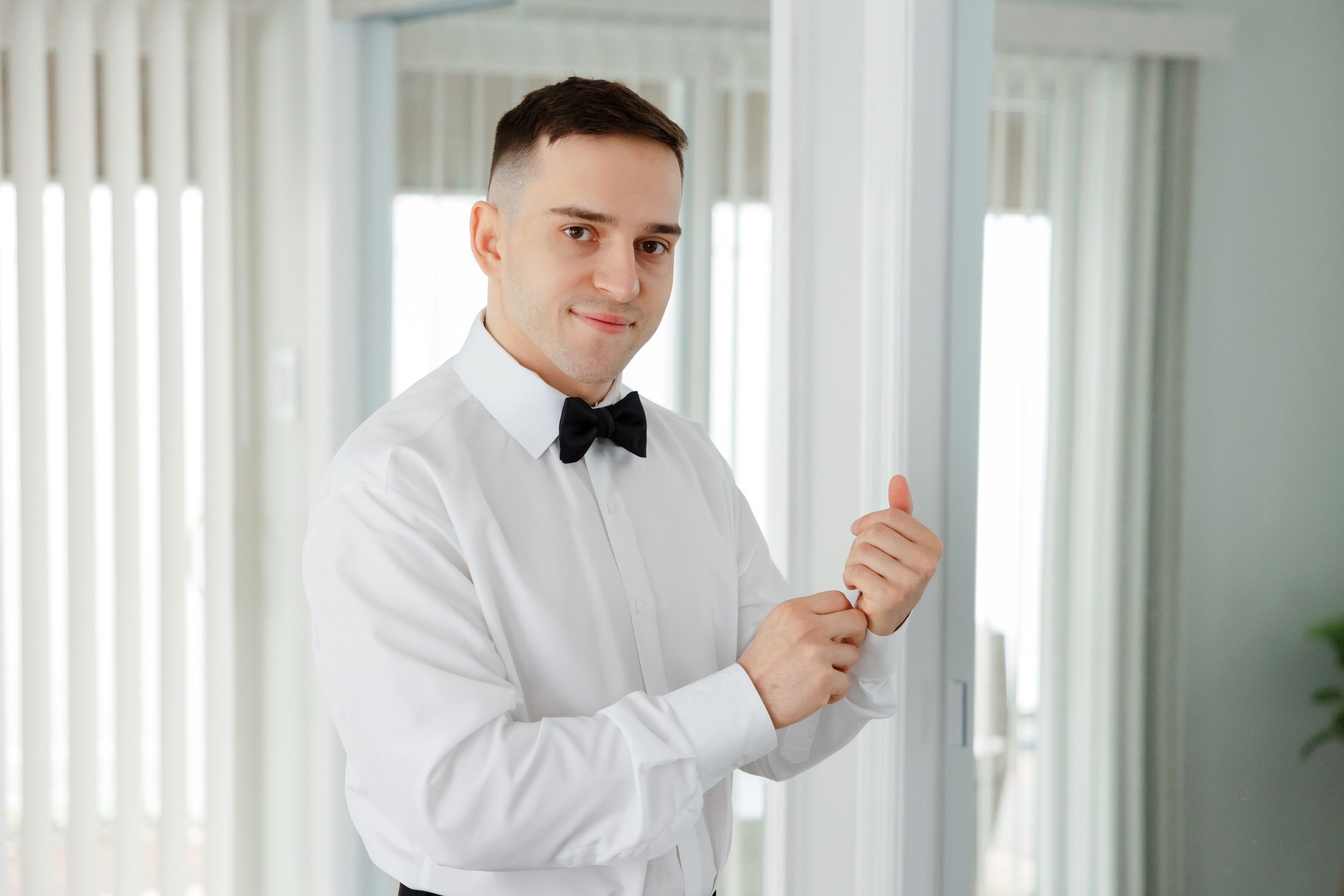 Groom getting ready for wedding day captured by Tom Forrest Photography from Hudson, Ohio.