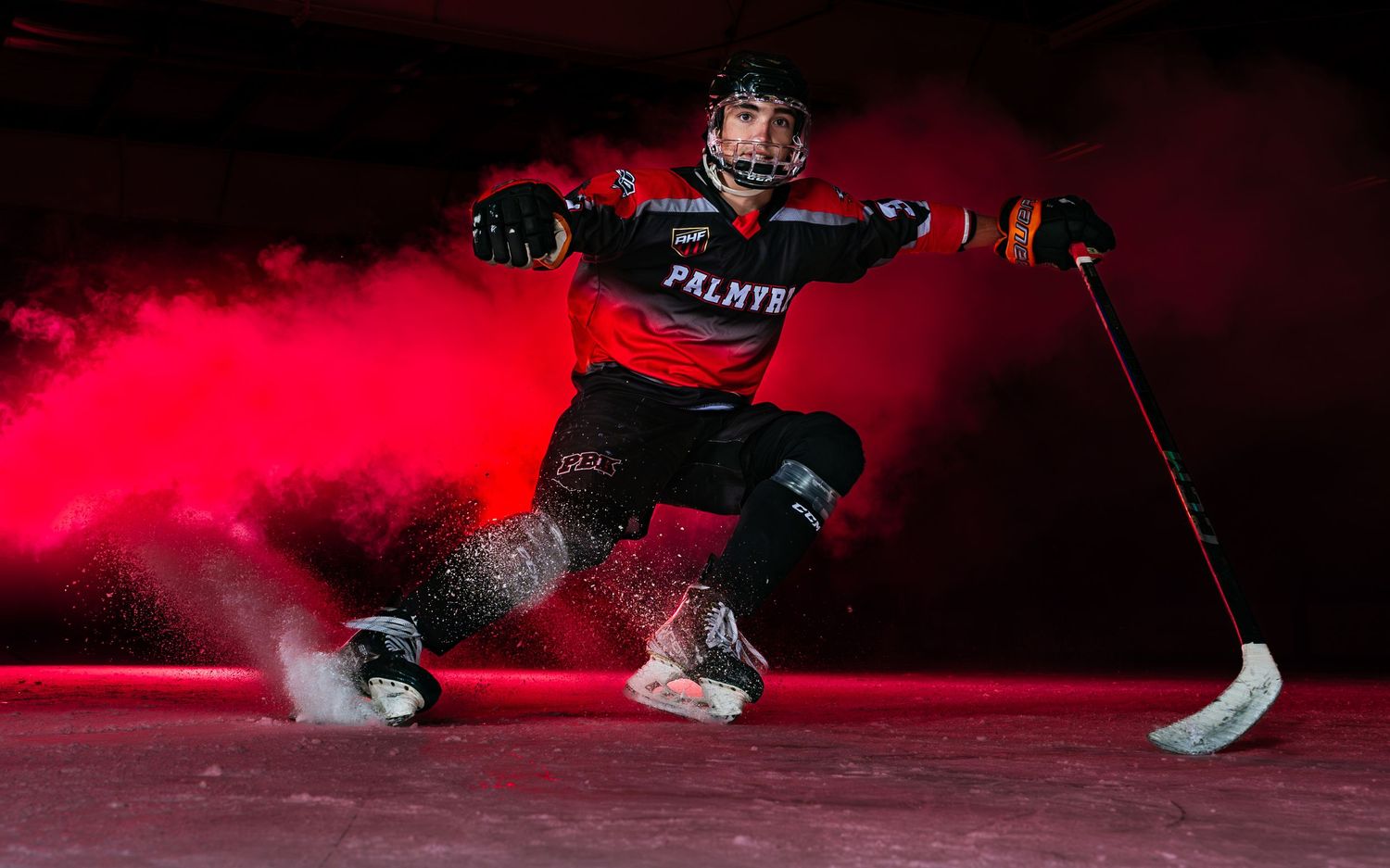 Palmyra Black Knights ice hockey player Media Day portrait with red smoke effects, by Deanna Fox, SportsFox Photography, Hershey PA