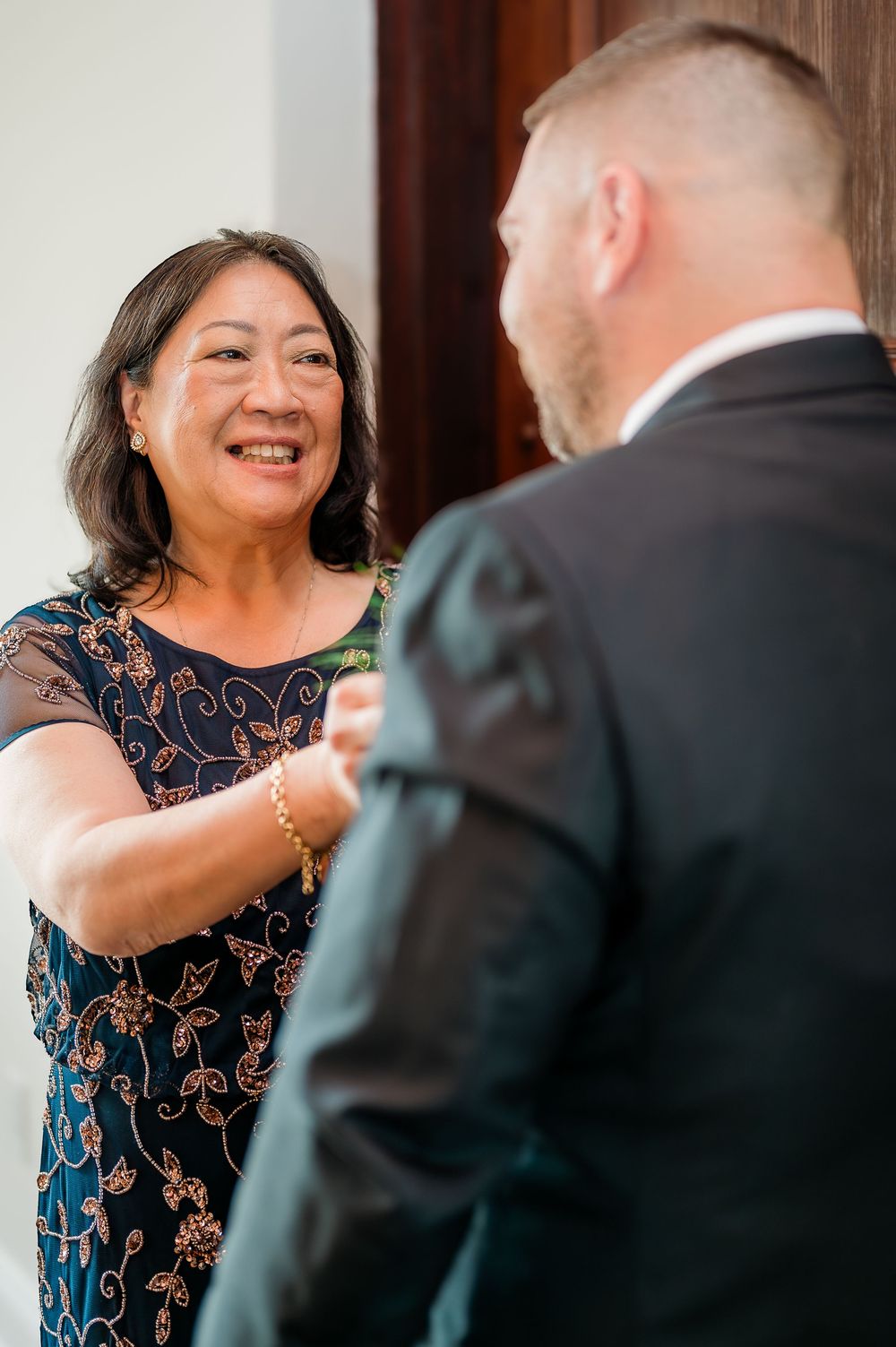 A joyful dance sequence showing a couple in formal wear sharing playful moments together.