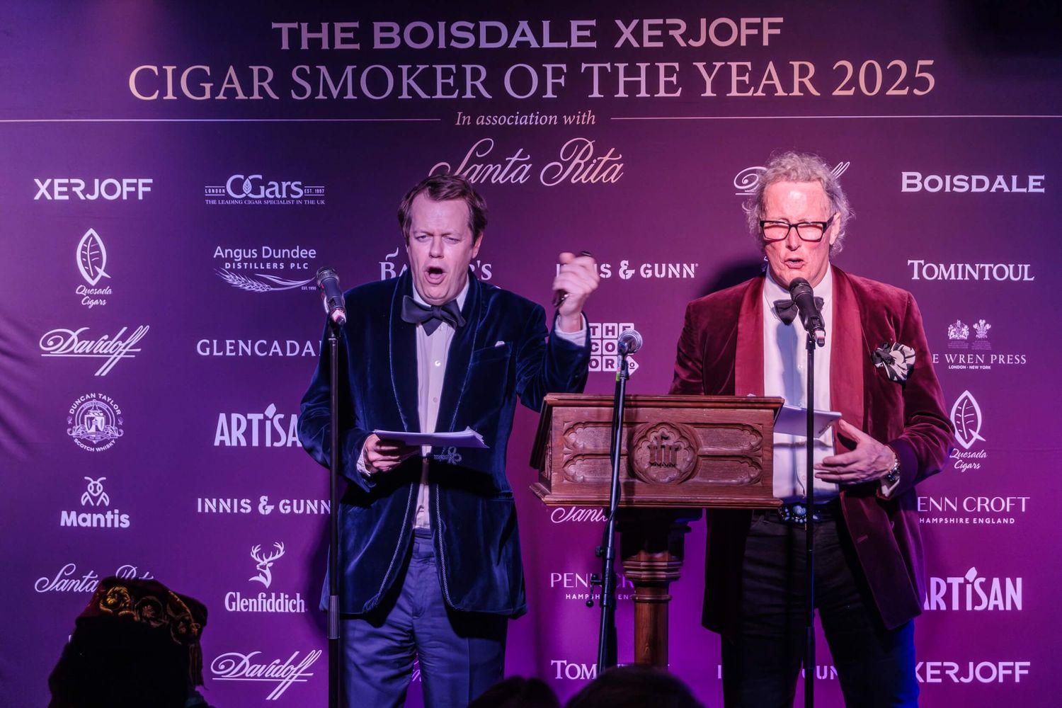 A purple-tinted banner for The Boisdale x Xerjoff Cigar Smoker of the Year 2025 event with sponsor logos.