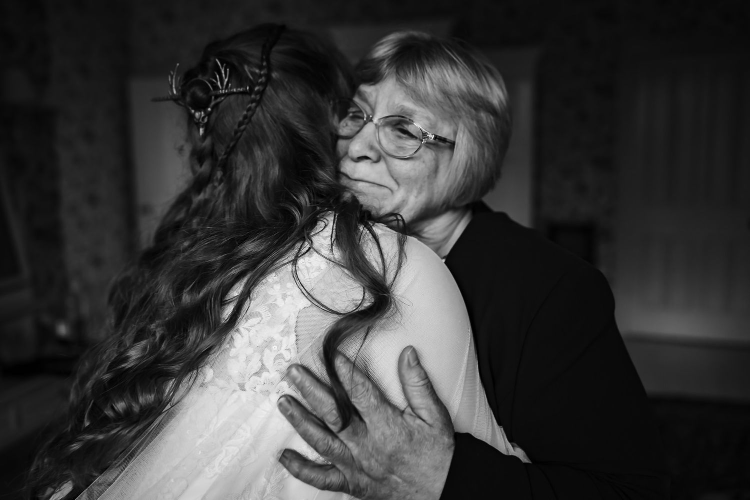 A series of romantic black and white wedding photographs showing intimate moments between newlyweds.
