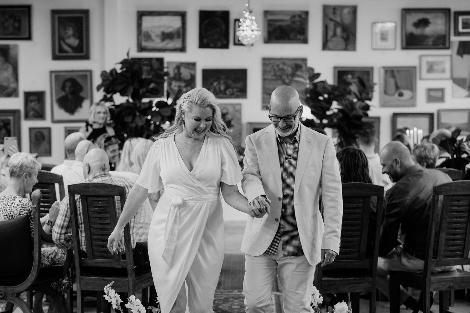 A celebration moment in a room filled with vintage photographs and artwork.