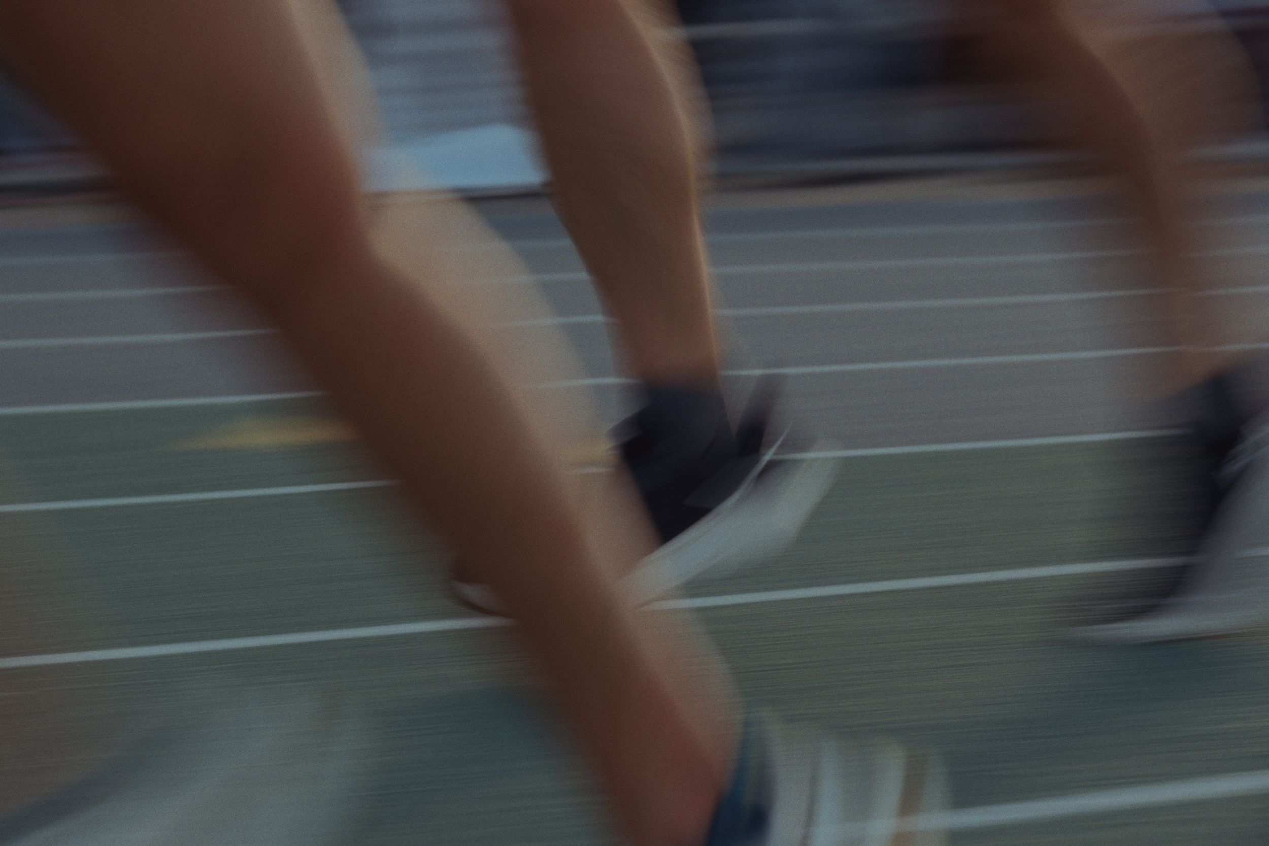 A montage of running shoes and feet in motion on a track during athletic training or competition.