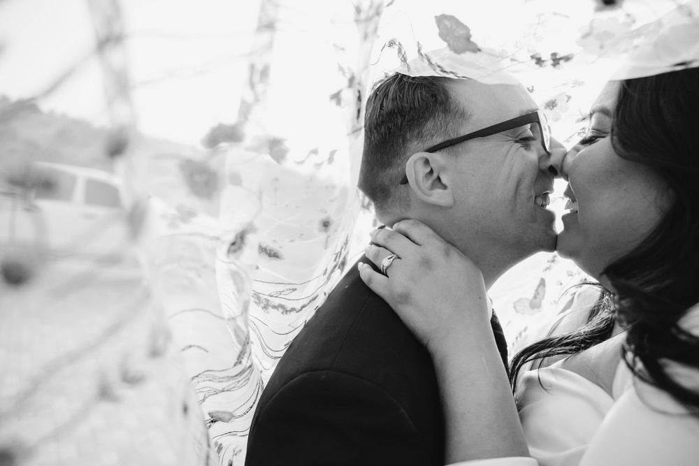 Romantic black and white portrait of a couple sharing an intimate moment.