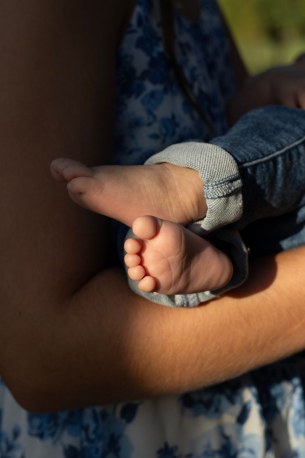 Up close shot of newborns tiny toes during a Raley and Roots, Family Photography Session.