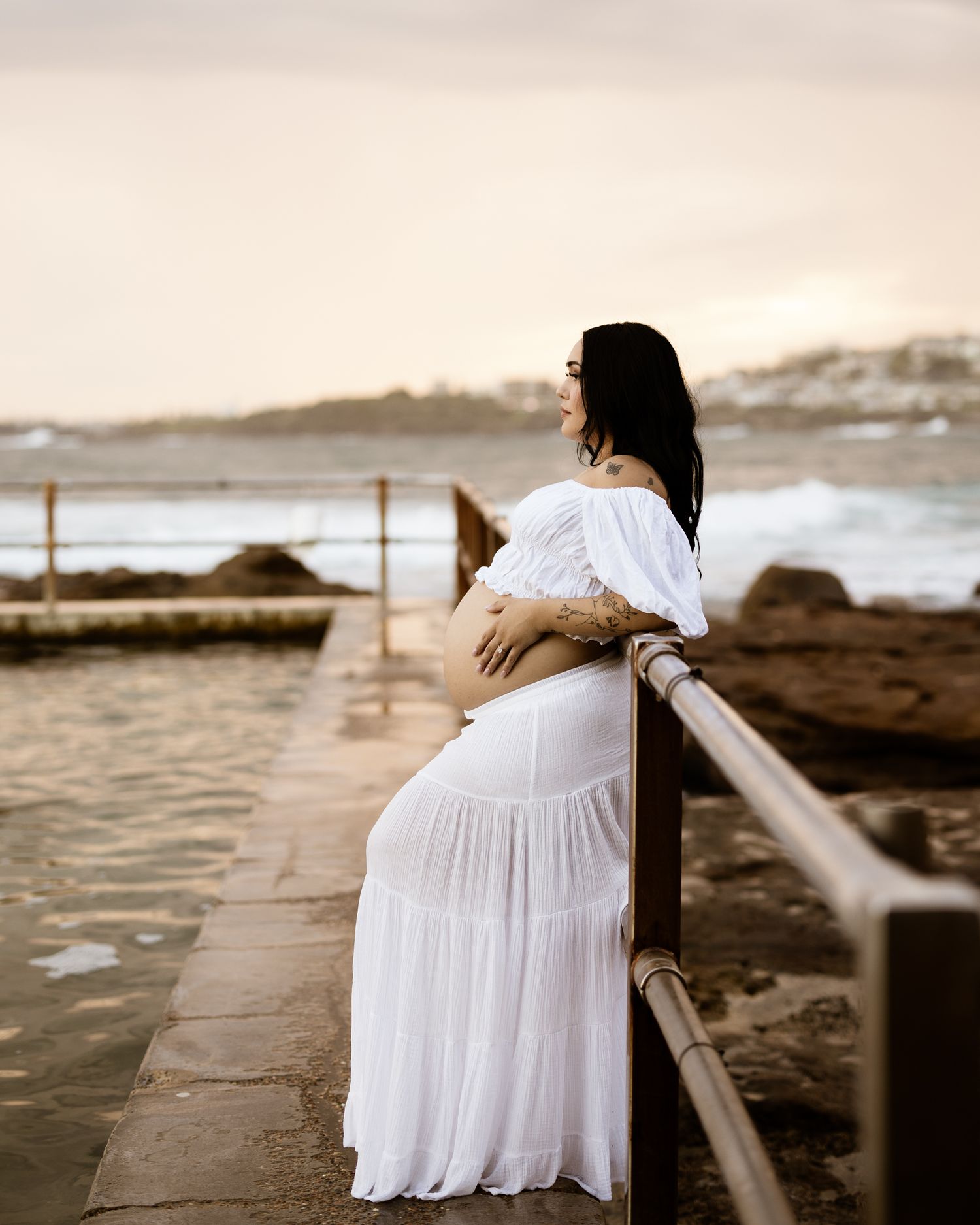 Glowing pregnant mama captured in golden light outdoors
